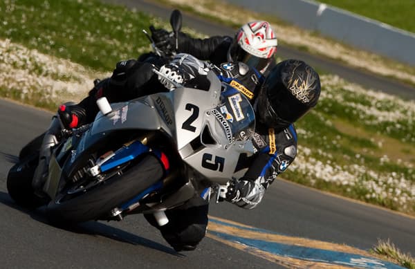 Coaches lead students to demonstrate specific techniques.